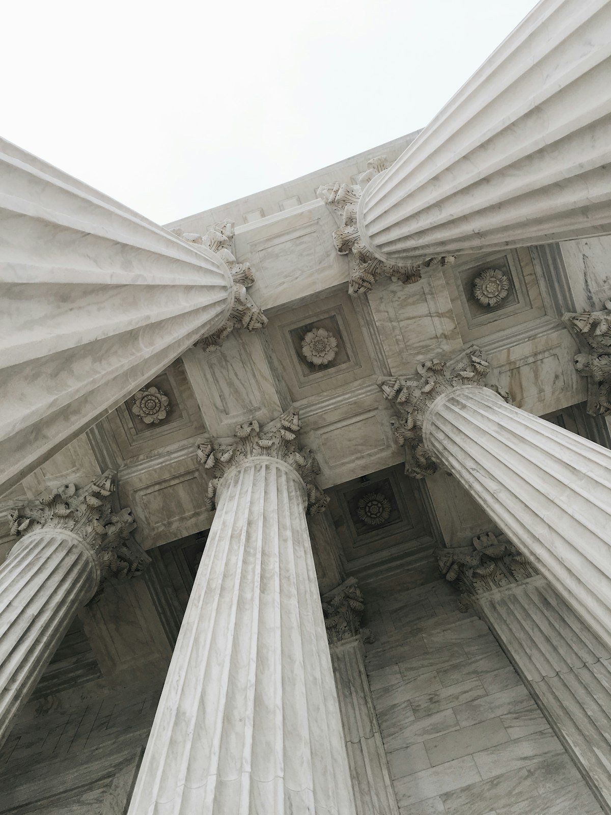 Classical fluted columns rising against the sky.